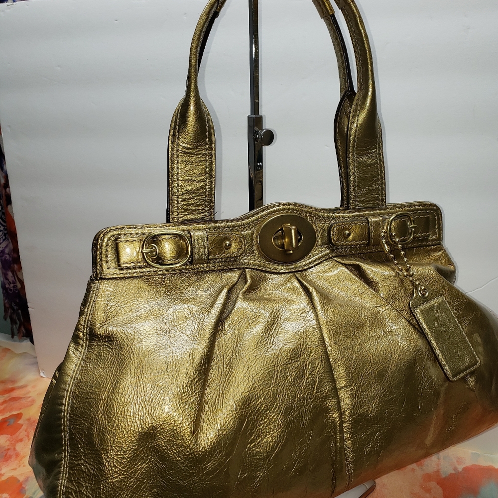 PRICE FIRM Coach patent leather gold color bag.